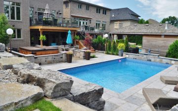 Pool, hot tub, stone retaining wall, privacy screen, upper deck