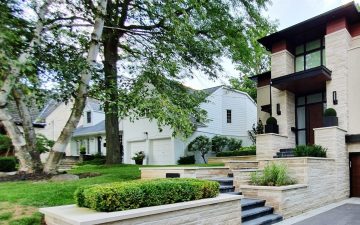 terraced entryway with stone steps and planters